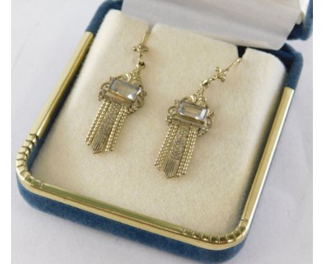 A pair of Art Deco style drop earrings, each set with a blue grey rectangular paste stone, in a gold plated setting, 3cm high