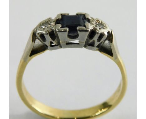 A sapphire and diamond dress ring, in the Art Deco style, set with square cut sapphire in four claw setting and flanked by tw