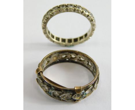 Two eternity rings, comprising a 9ct white gold cz dress ring, ring size K½, and a 9ct gold and silver heart shaped eternity 