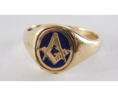 A 9ct gold Masonic signet ring, with a blue enamel backing on a rose gold, Masonic symbol on a yellow gold band, ring size P½