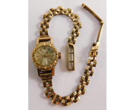 A Rotary ladies wristwatch, on a 9ct gold bar strap, in a plated casing, 11.1g all in.