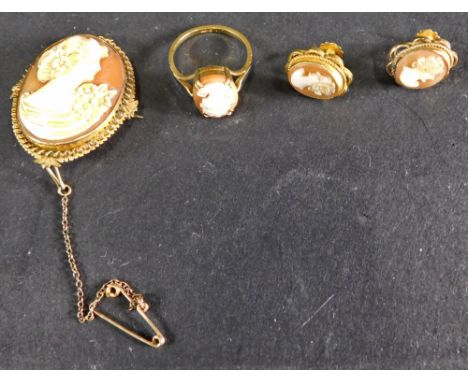 A suite of 9ct gold cameo jewellery, comprising a oval brooch in elaborate frame, 21.5cm x 3cm with safety chain back, a came