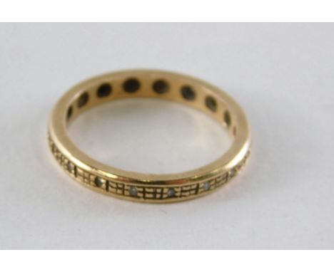 A dress ring, set with tiny diamonds, of box design, yellow metal stamped 375, ring size K½, 2g all in.