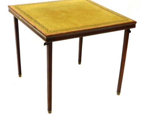 An oak card table, the baize top  with a floral garland decoration, on square tapering legs terminating in brass caps, 72cm h