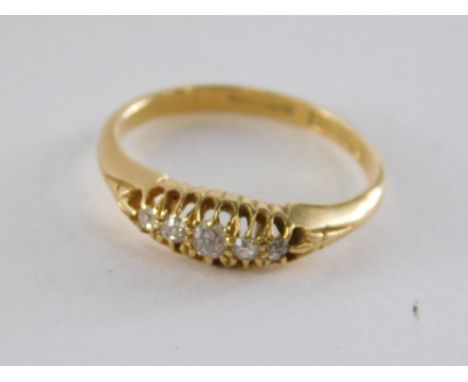 An 18ct gold diamond gypsy ring, set with five old cut diamonds, each in claw setting, ring size M½, 2.9g all in.