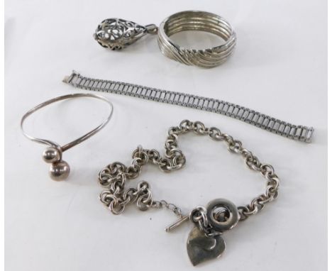 A group of silver and other costume jewellery, comprising of hinged bangle, pendant of scroll design, torc bangle, etc., 85g 