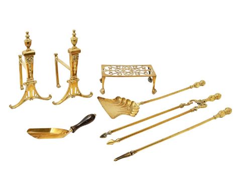 A pair of brass fire dogs, early 20th c, 35cm h, a set of brass fire tools and a trivet (7) 
