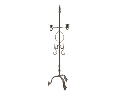 A wrought iron tripod candlestick, 20th c, in 17th c English style, scrolling tripod base with slender central stem, 78cm h  