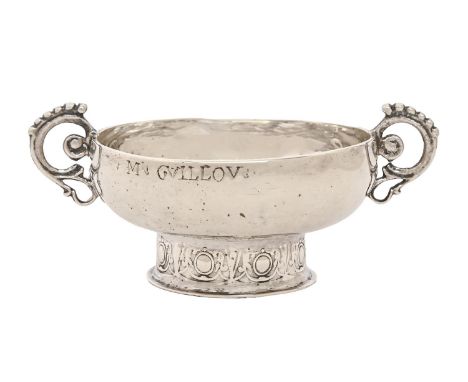 A French Provincial silver christening bowl, engraved M GUILLOU, having scroll handles on chased foot, 13.5cm over handles, m