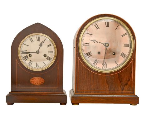 A Victorian inlaid mahogany arched top mantle clock, with silvered dial, pendulum and key, 32cm h; 23 x 13cm and a contempora