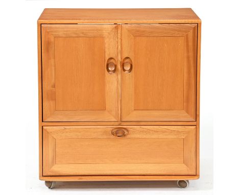 An Ercol oak television cabinet, on castors, 94cm h; 51 x 85cm  A couple of light ring marks and scratches on top, but in ove