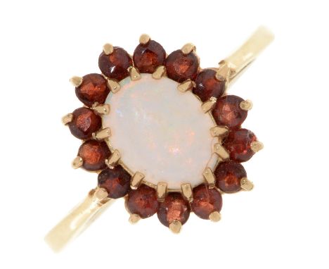 An opal and garnet ring, in 9ct gold, part marked, 2.2g, size M  Good condition