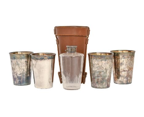 An EPNS mounted glass hunting flask and set of four beakers, c1930, with bayonet cap, 13cm h, in chamois lined tan leather ca