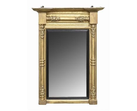 A George III giltwood and composition overmantle mirror, the plate with ebonised surround, flanked by a pair of pillars, 72 x