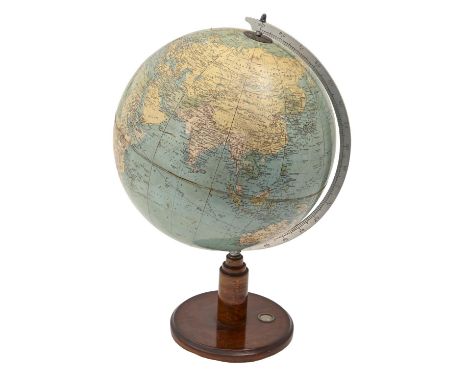 A Philips' 13½in terrestrial globe, c1935, on turned mahogany base inset with compass, 53cm h  Some wear to sphere with crack