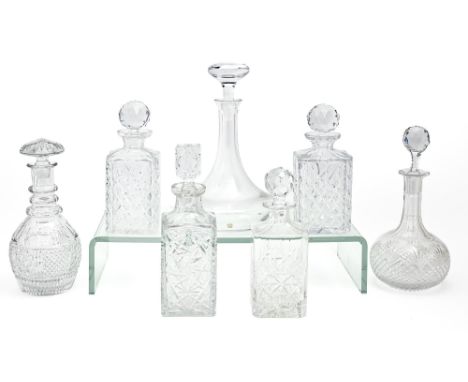 Six cut glass decanters and stoppers and a Sevres glass decanter and stopper, early 20th c and later, 31cm h and smaller, etc