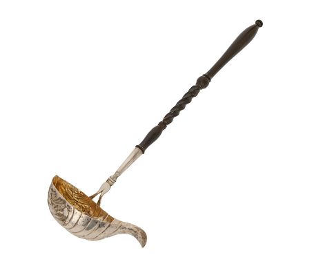 A Continental silver punch ladle, 19th c, the fluted bowl chased with shells, turned ebonised handle, 42cm l, marked Freij an