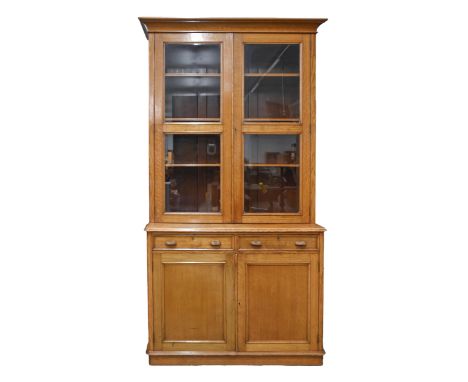 An Edwardian light oak bookcase, fitted with adjustable shelves, 226cm h; 60 x 116cm  A very well preserved example of reason