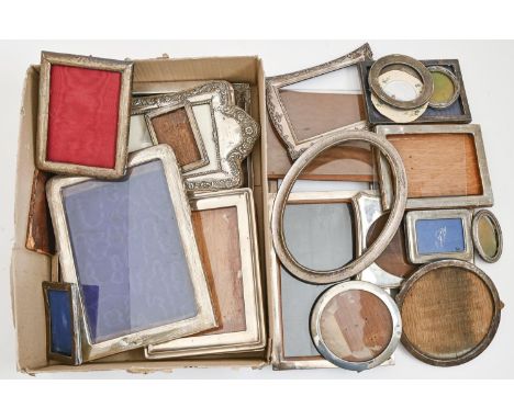 Miscellaneous oblong, oval, circular and other silver photograph frames, mostly first half 20th c, various sizes, makers and 