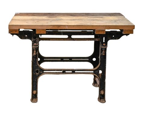 A cast iron work bench, mid 20th c, with boarded top, 84cm h; 53 x 122cm  Base with some minor surface rust, top marked with 