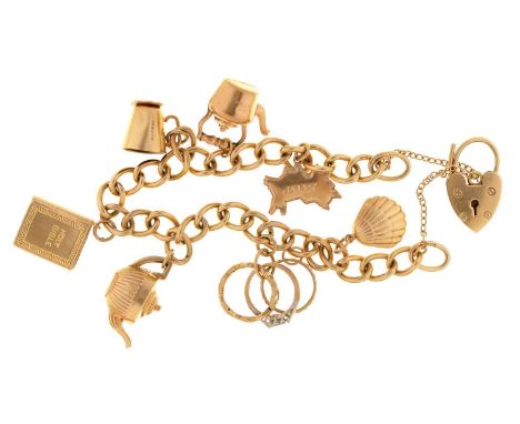 A gold charm bracelet and padlock, with a collection of gold charms, 16cm l, links individually marked, 23g  Light wear