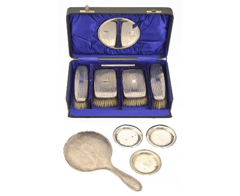 A George V silver gentleman's brush set, engine turned, by The Daniel Manufacturing Co, Birmingham 1932, cased, a silver hand