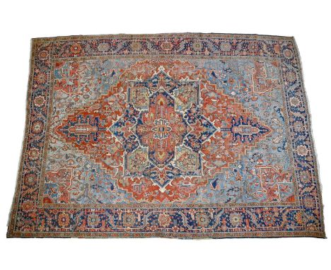 A Middle Eastern carpet, 393 x 295cm  Faded in places, worn to edges