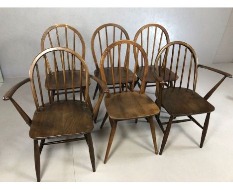 Six Ercol stick back chairs, to include two carvers