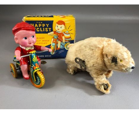 Vintage Toys: tinplate and plastic clockwork toy 'The Happy Cyclist' (A/F), in original box, and a clockwork polar bear 