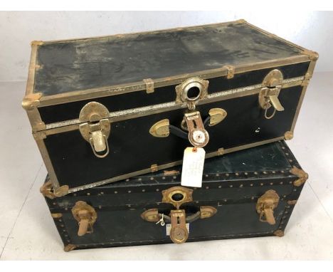 Two vintage travel trunks, one with labels and tickets from the 'North German Lloyd' shipping company