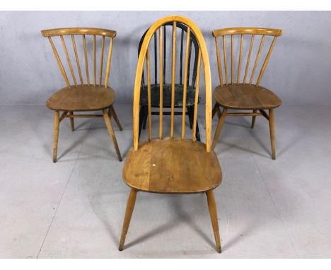 Four Ercol dining chairs, to include a pair of blond stick back chairs