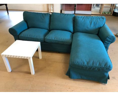 Modern L-shaped three seater sofa in green fabric, with a white coffee table, sofa approx 245cm x 165cm