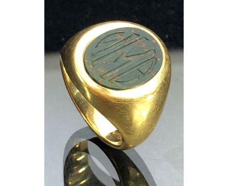 14ct Gold chunky signet ring set with an engraved bloodstone and approx size 'M' &amp; total weight 16.3g