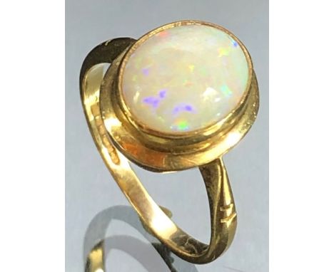 9ct Gold ring set with a Opal Gemstone, Oval approx 10 x 8.4mm, fully hallmarked approx size 'M'