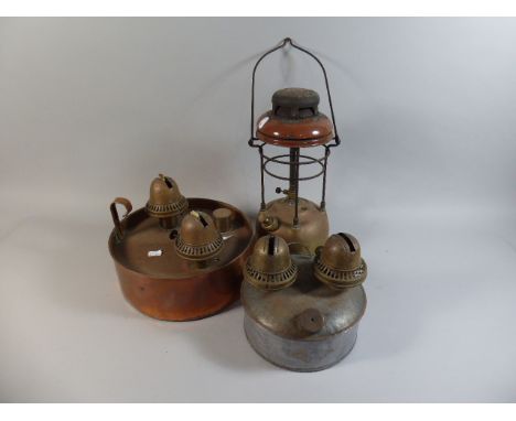 A Vintage Hurricane Lamp and Two Brooding Lamps 