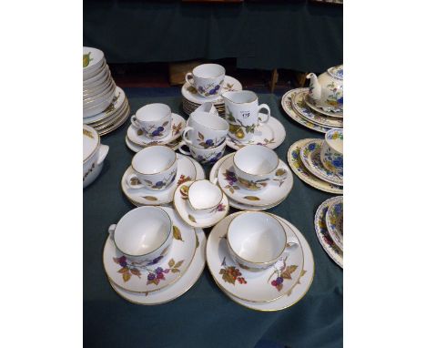 A Collection of Royal Worcester Evesham Vale Tea Wares to Include Five Trios, Three Cups, Jug, Side Plates Etc.   
