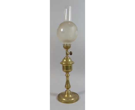 A Brass Oil Lamp with Glass Shade, 42 Cm High