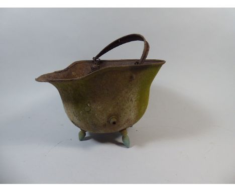 A German Military Helmet Converted to Plant Pot by The Addition of Four Legs 