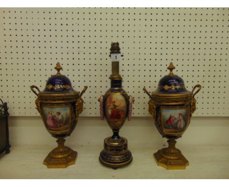 A Sevres porcelain lamp and two urns