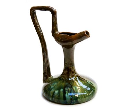 Christopher Dresser for Linthorpe, an Aesthetic Movement art pottery ewer, circa 1880, the compressed body with elongated nec