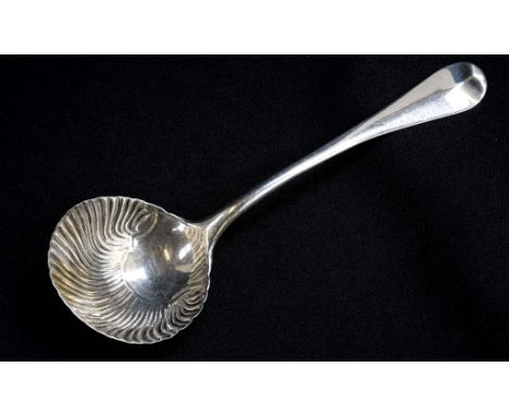 An early George III Hanoverian pattern sterling silver sauce ladle with shell bowl, period engraved crest to finial verso, sp