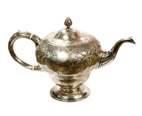 A George II Scottish sterling silver inverted pear shaped teapot, with period rococo foliate decoration to upper half of body