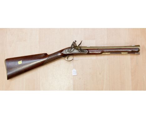 A Hewson of London blunderbuss, complete with tamper stick, brass barrel, flintlock action, length 75cm