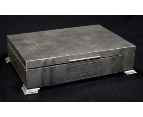 A superb Elizabeth II sterling silver desk top box with hinged cover and cedar wood lined interior and engine turned decorati