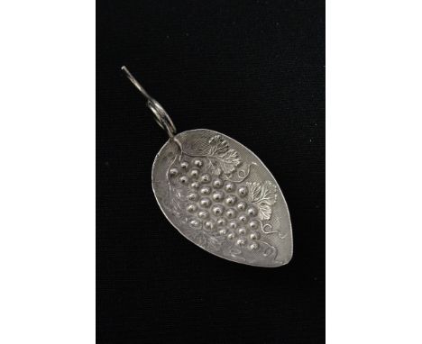 A George III sterling silver leaf form tea caddy spoon with embossed fruiting vine decoration and sinuous stem form handle, s