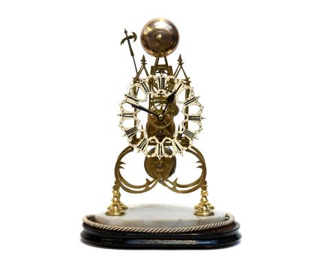 A 19th Century brass 'Lichfield Cathedral' skeleton clock, under a glass dome, (key and pendulum)
