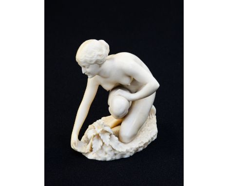 An Art Deco carved ivory figure, in the style of Ferdinand Preiss, circa 1925, modelled as a nude woman collecting water from