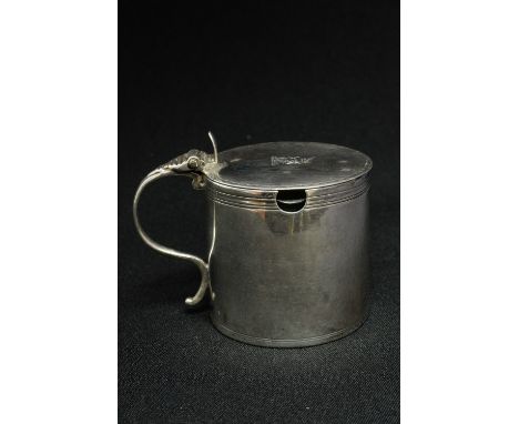 A fine George III sterling silver drum form mustard, cover with bright cut border, period engraved crest of a unicorn, remova