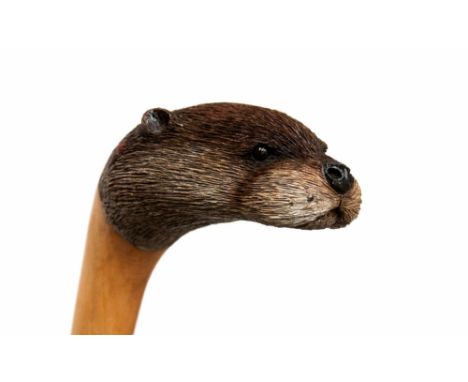 Ian Taylor, a fine hand made and hand carved sycamore walking stick, the handle finely executed in the form of an Otter's hea