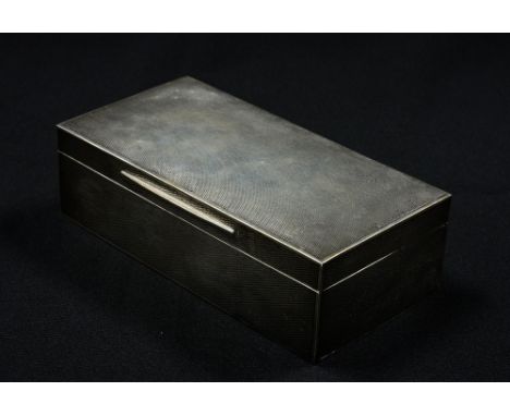 A George V Asprey sterling silver box, of rectangular form, with hinged lid and engine turned decoration, wood lined interior